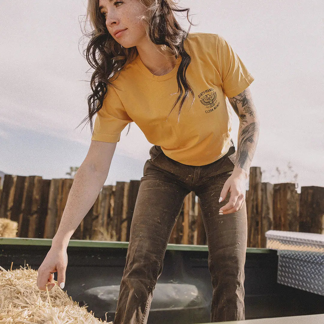 Lexi wearing the gold Free Bird t-shirt